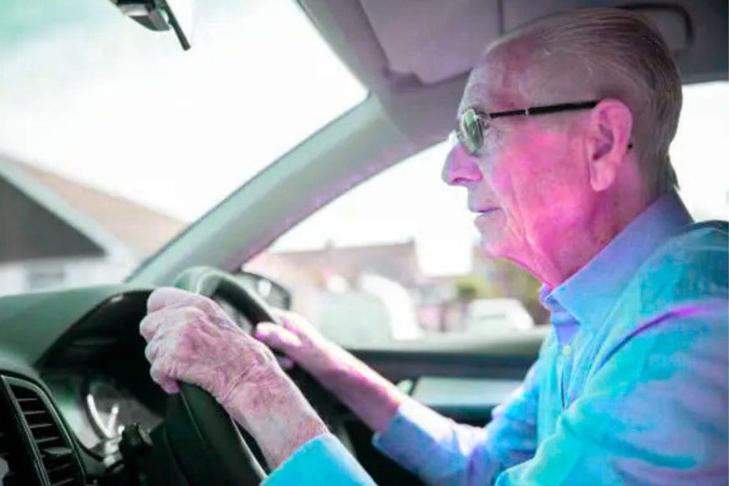 Senior man driving his car carefully, illustrating why low-mileage drivers often enjoy lower car insurance premiums.