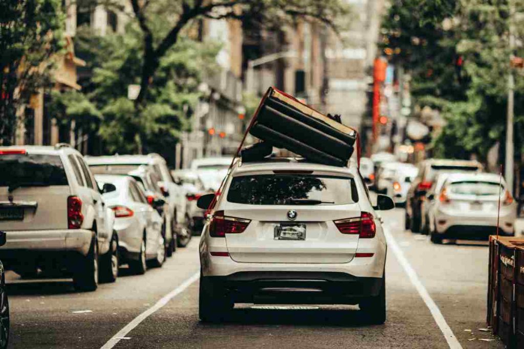 Row of white delivery vans at rest, showing vehicles covered under USAA commercial auto insurance.
